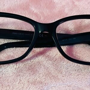 Jimmy Choo Glossy Black Eyewear. I can send better pictures if needed.